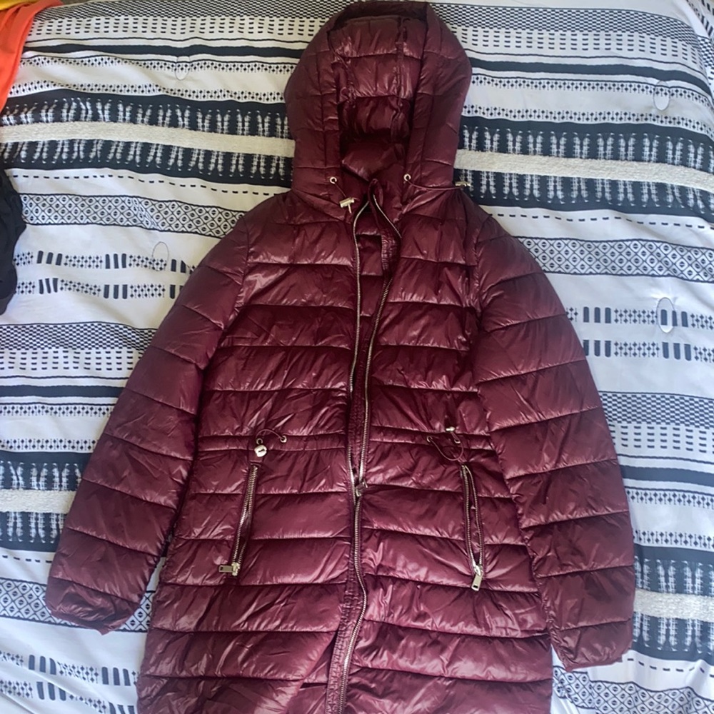 A burgundy rain puffer coat size medium by the brand love tree